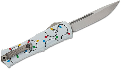 Microtech 1703M - 10WHCMAS Signature Series Hera II Mini OTF AUTO Knife 3" M390MK Stonewashed Drop Point Plain Blade, Christmas White Deep Engraved Aluminum Handles - timberknives.com