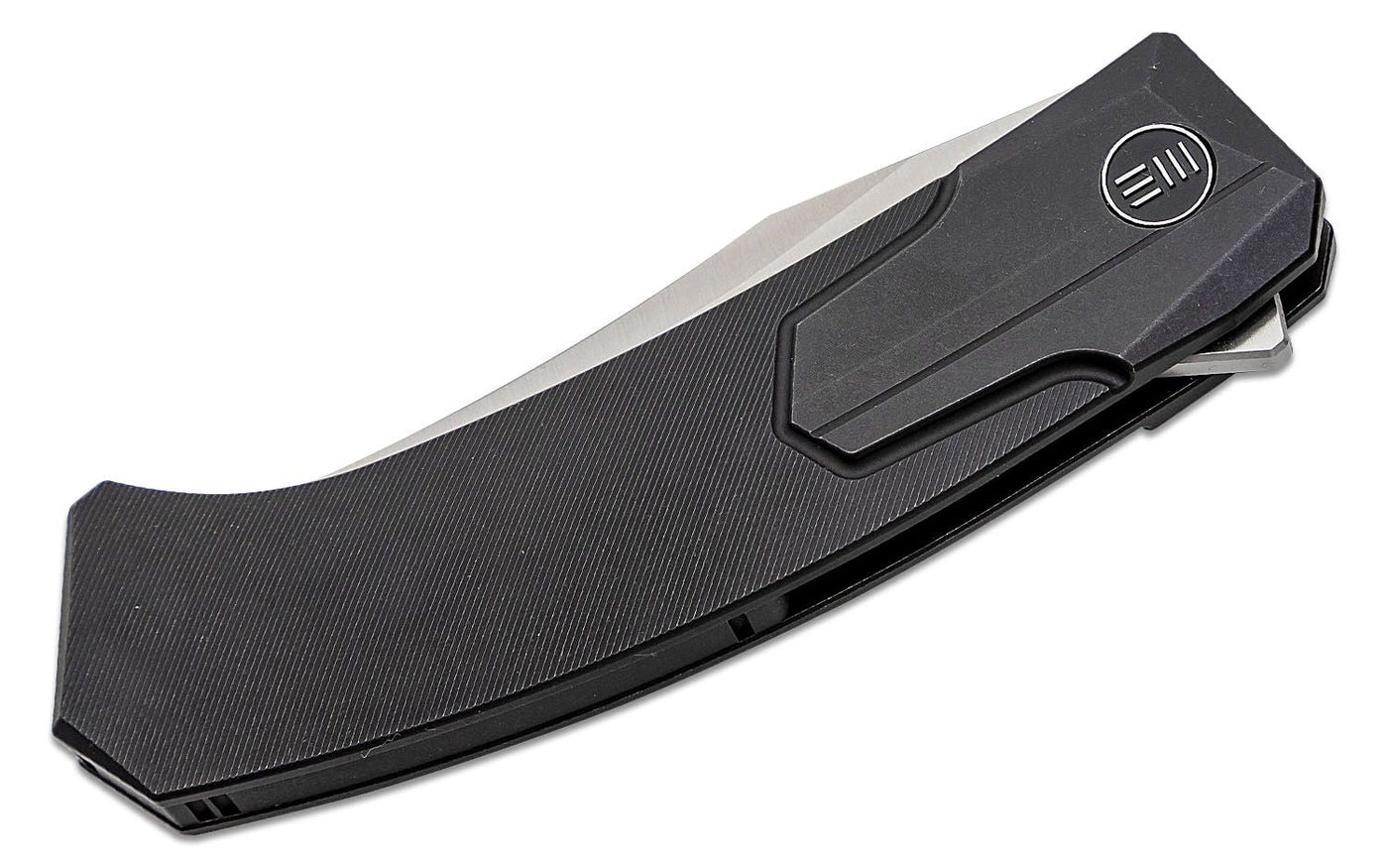 We Knife Rafal Brzeski Shuddan Flipper Knife 3.48" CPM - 20CV Satin Trailing Point Bowie Blade, Black Titanium Handles, Frame Lock - WE21015 - 1 - timberknives.com